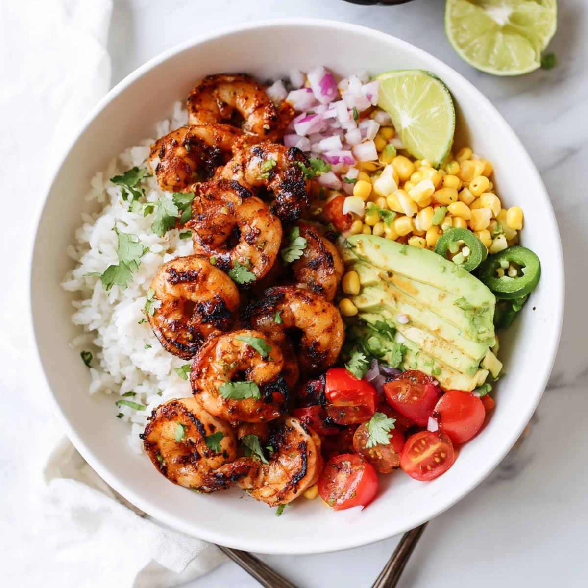 Deliciously fresh grilled shrimp bowl with creamy avocado and sweet corn highlights.