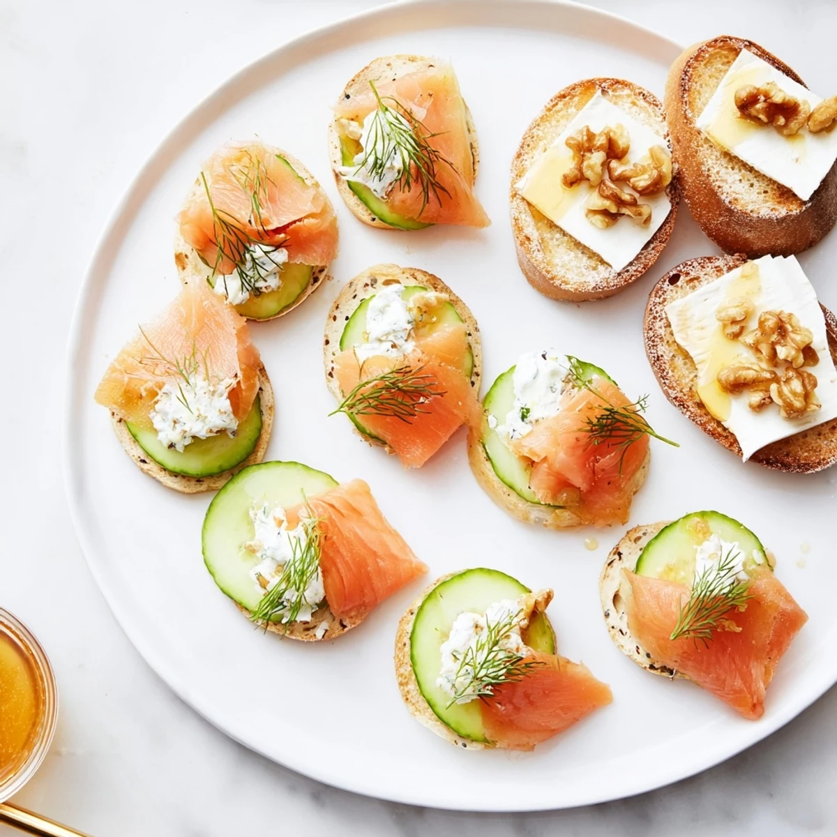 Delectable arrangement of champagne pairings, including smoked salmon bites and creamy brie cheese.