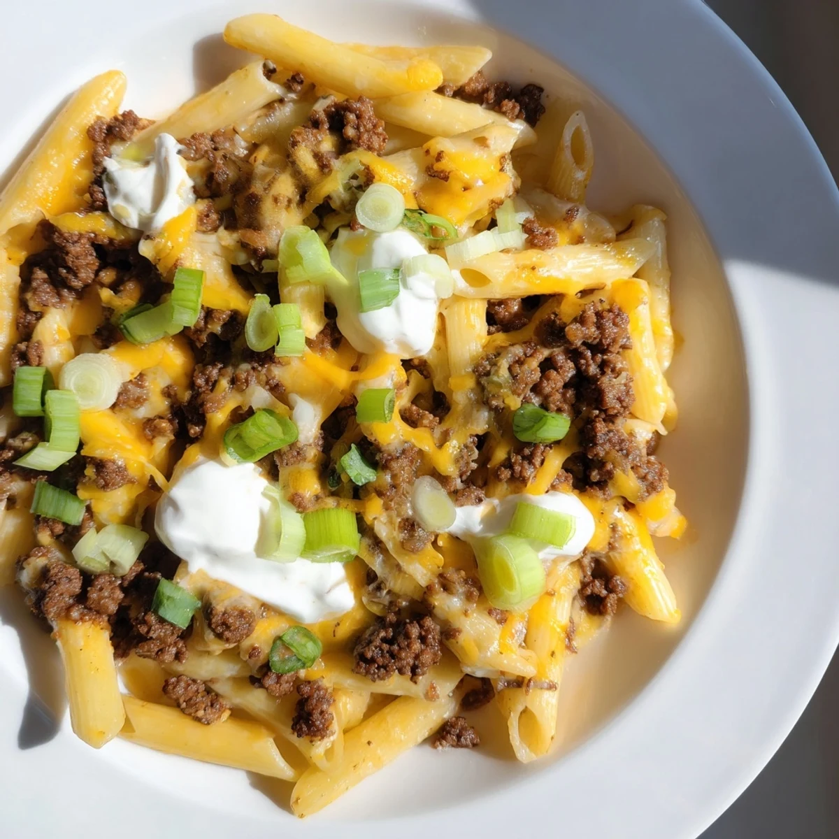 A comforting bowl of one-pot taco pasta, fragrant with herbs and spices, perfect for a weeknight dinner.