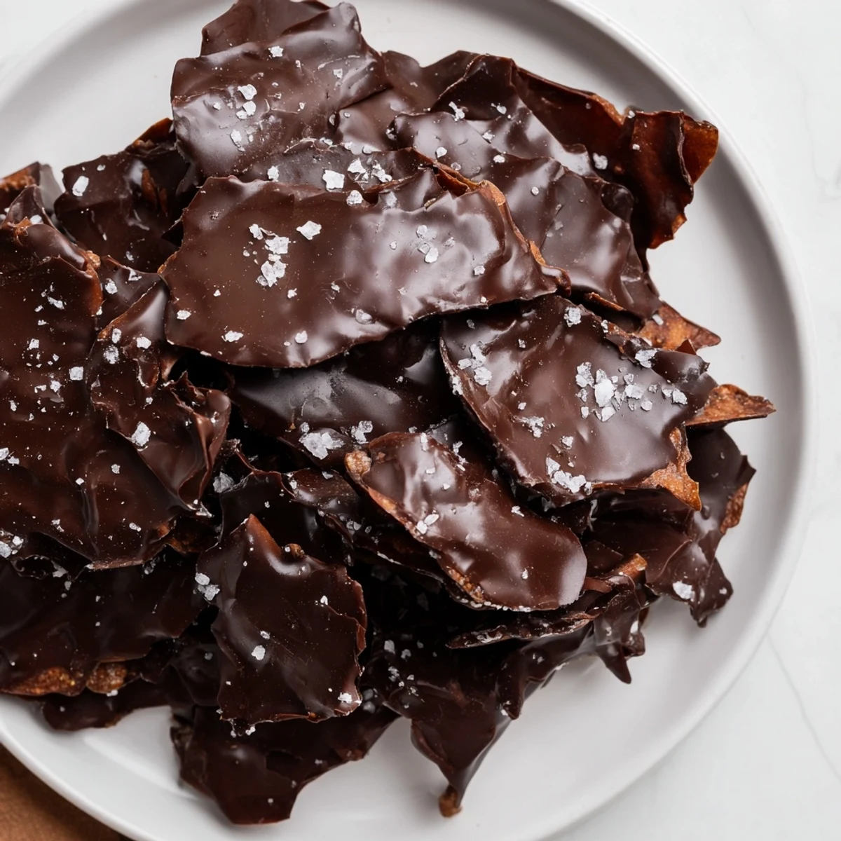 Melted chocolate combines with crunchy potato chips in this easy Chocolate Potato Chip Bark recipe.