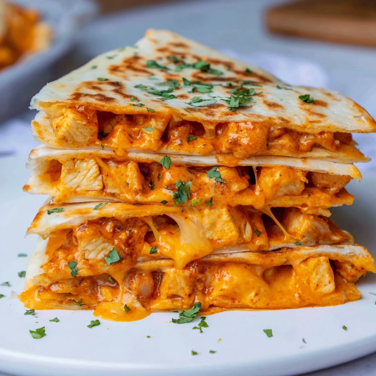 Golden brown Butter Chicken Quesadillas, a delightful fusion of Indian and Mexican cuisine, ready to eat.