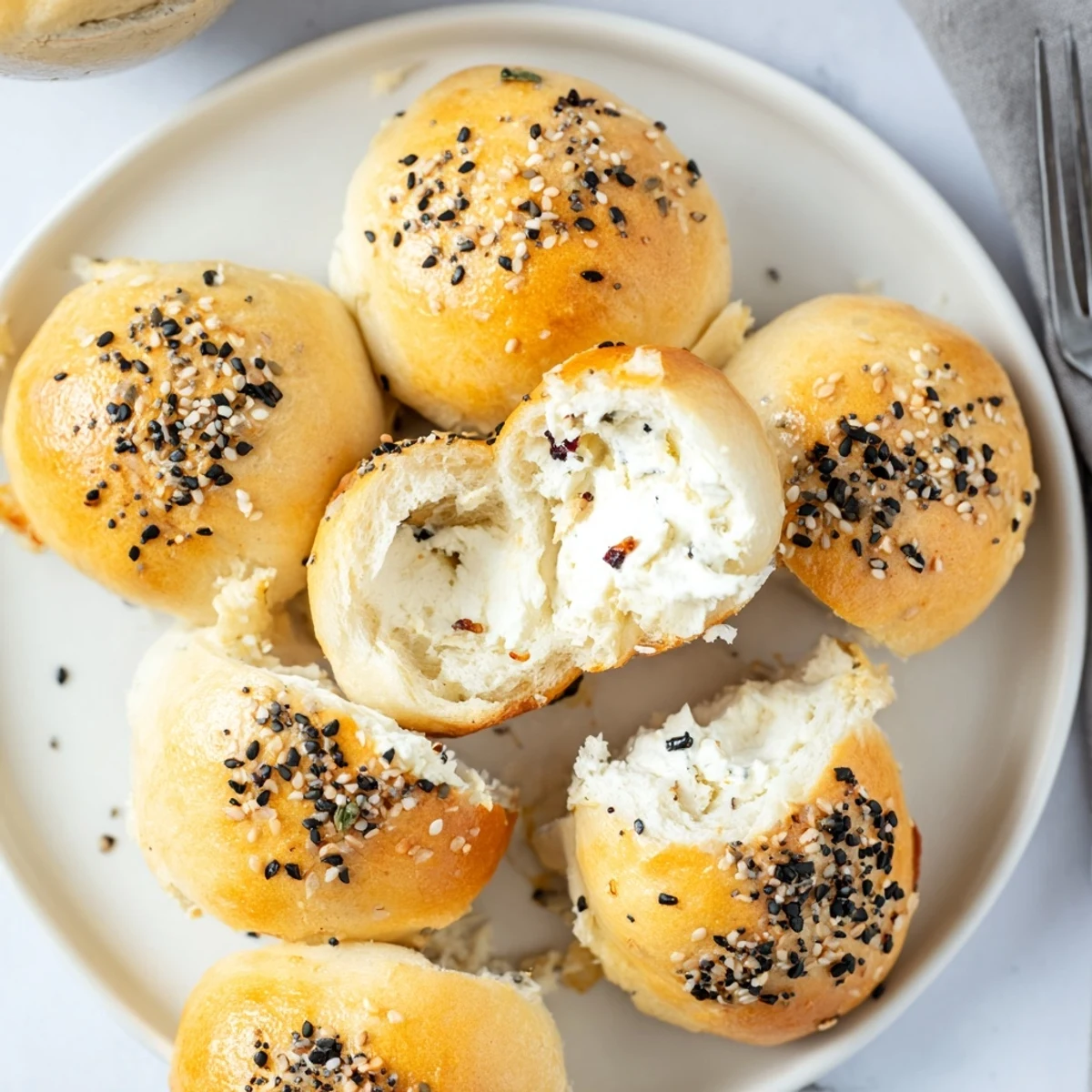 Soft bagel bombs filled with spicy cranberry jalapeño dip, perfect for gatherings.  