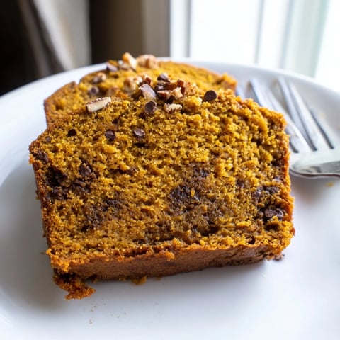 Sweet Tea Pumpkin Pancake Muffin Loaf topped with glaze, offering a cozy breakfast vibe.  