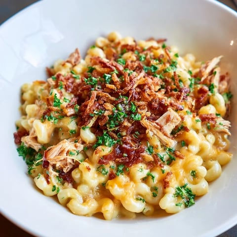 One-Pot Honey BBQ Chicken Mac and Cheese, bubbling and cheesy with crispy onion topping.
