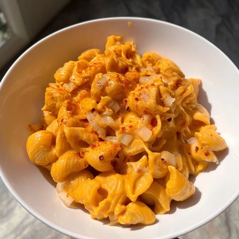 One-Pot Butternut Squash Mac & Cheese, with a swirl of creamy sauce on each pasta shell.