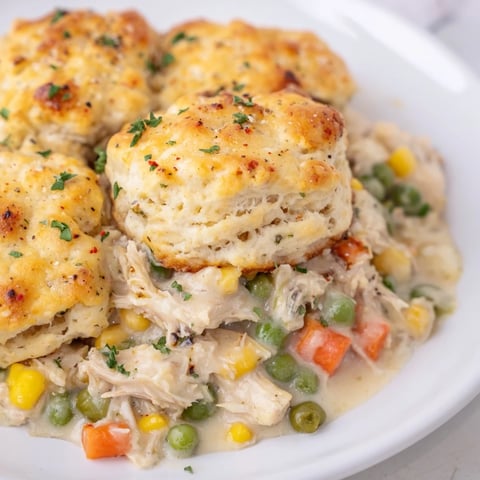 Golden-brown Chicken Cobbler with Red Lobster mix, bubbly filling, and fluffy biscuit topping ready to serve.