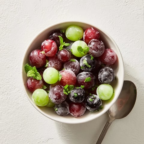 Cool, crisp frozen grapes—a simple, healthy snack bursting with sweet, icy goodness for a spa day.