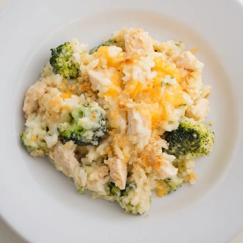 A close-up view of creamy, cheesy Chicken & Broccoli Rice Casserole with a crispy breadcrumb topping.