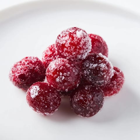 Close-up of sparkling, candied cranberries, adding a pop of color as a gluten-free garnish.