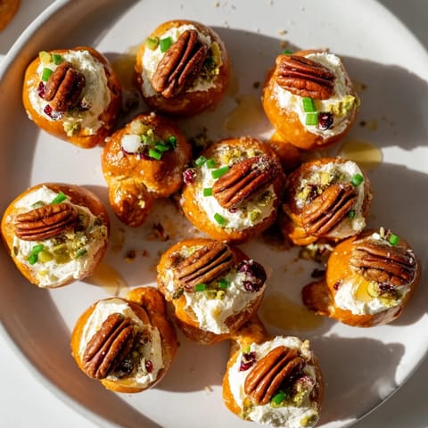 Enjoy these bite-sized Rocket Fuel New Year's Eve Treats—salty pretzels topped with creamy, festive flavors.