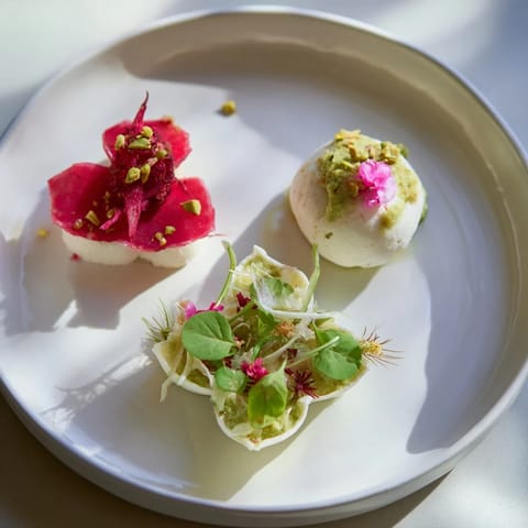 Elegant Lucky Clover Seasonal Starters plated with vibrant green purée and sliced beets, ready to be enjoyed.
