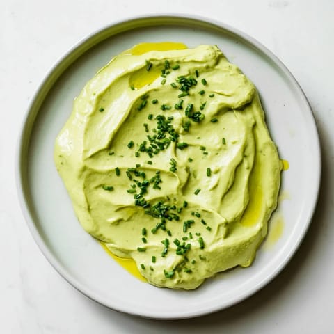 Homemade Avocado Cottage Cheese Dip, a smooth and luscious appetizer, perfect for quick snacking.