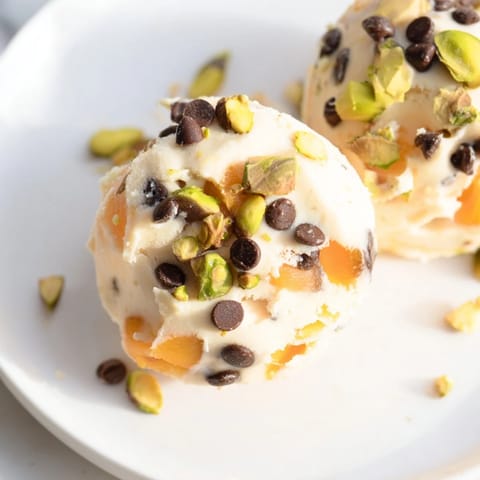 Bite-sized Frozen Peach Yogurt Bites, showing the creamy texture and sweet peach chunks before freezing.