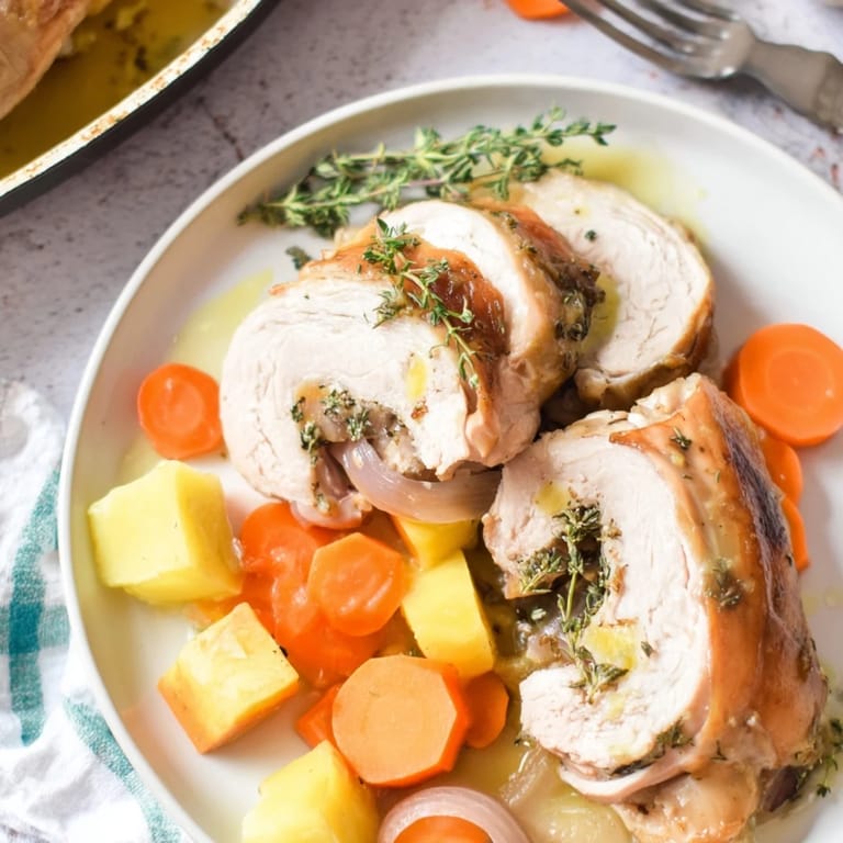 Golden-brown Sheet-Pan Roasted Turkey Breast alongside colorful winter vegetables, glazed and ready for eating.