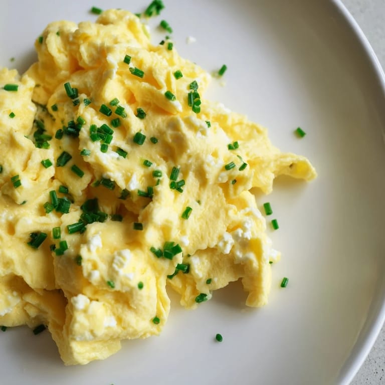 These creamy Cottage Cheese Scrambled Eggs are light and airy, ready for a protein-packed meal.