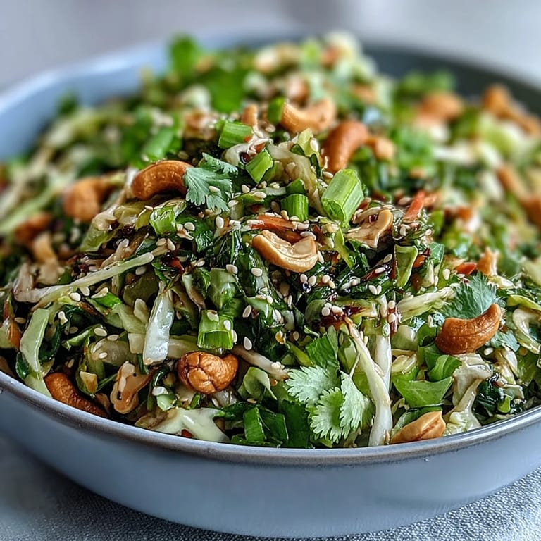 Refreshing Asian Cabbage Salad served on a plate beside grilled chicken, perfect for a light summer lunch.