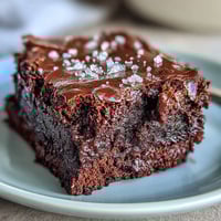 Rich fudgy sourdough discard brownies topped with sea salt flakes for a perfect sweet-salty balance.