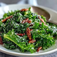 A vibrant arugula salad drizzled with zesty lemon vinaigrette and topped with delicate Parmesan shavings for a fresh, tangy bite.