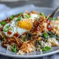 Kimchi cabbage fried rice with tangy kimchi, crisp vegetables, and a golden fried egg—colorful, hearty, and bursting with Korean flavor.